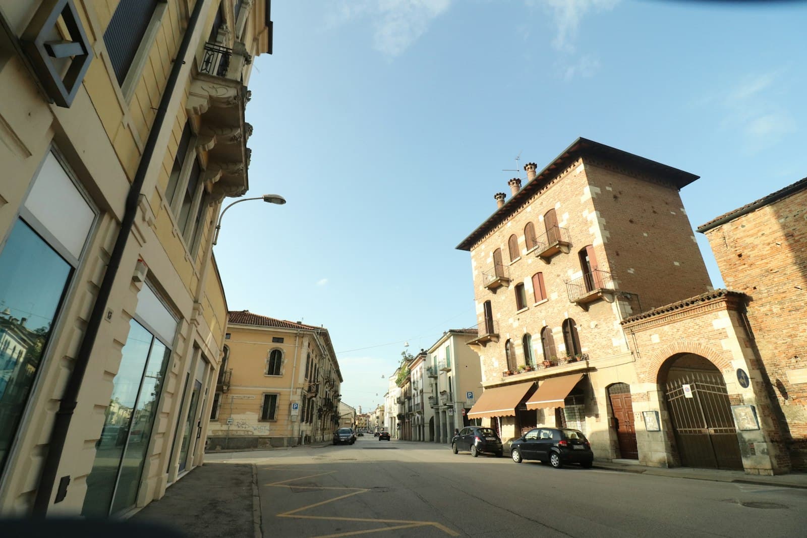 Vicenza — cars parked on side of the road near buildings during daytime