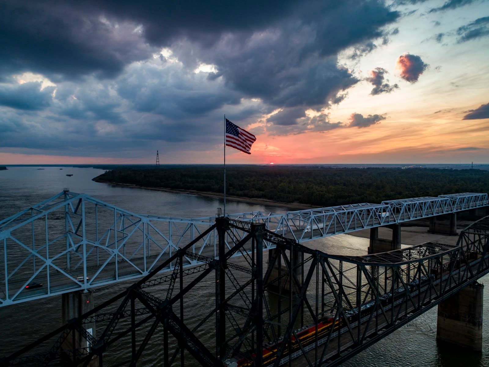 Vicksburg — a bridge that has a flag on top of it