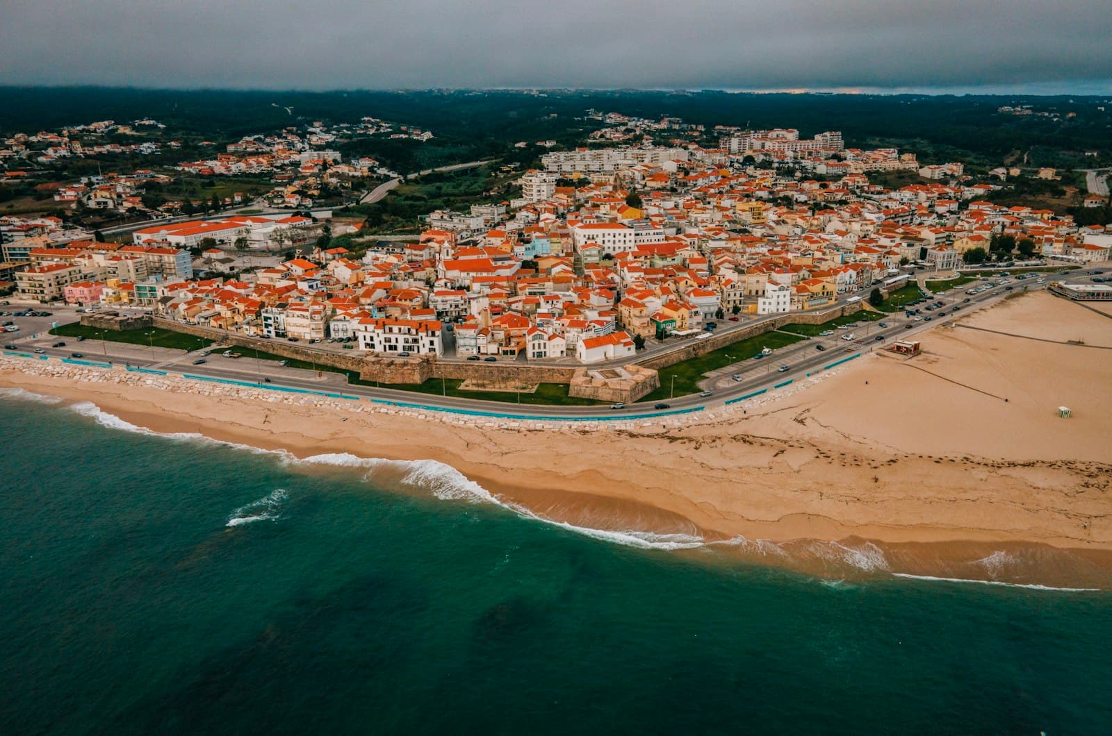 Vila Viçosa — aerial view of city buildings near body of water during daytime