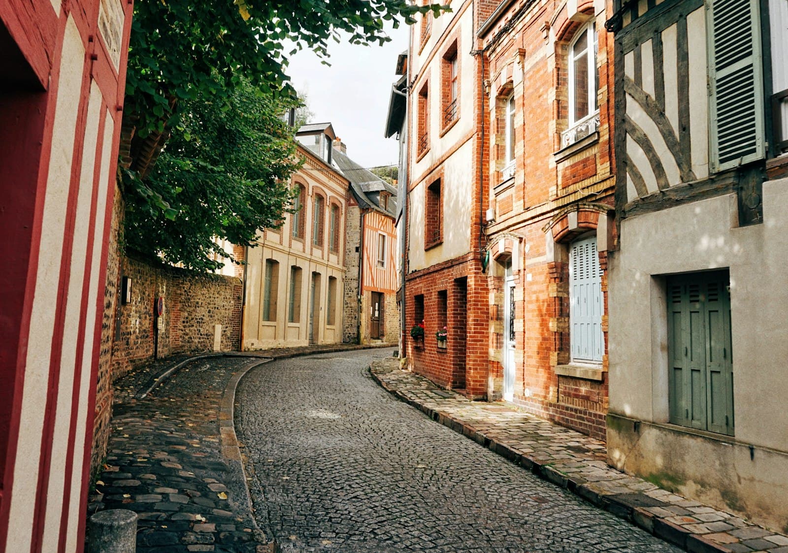Villefranche-sur-Saône — a narrow cobblestone street in an old european city