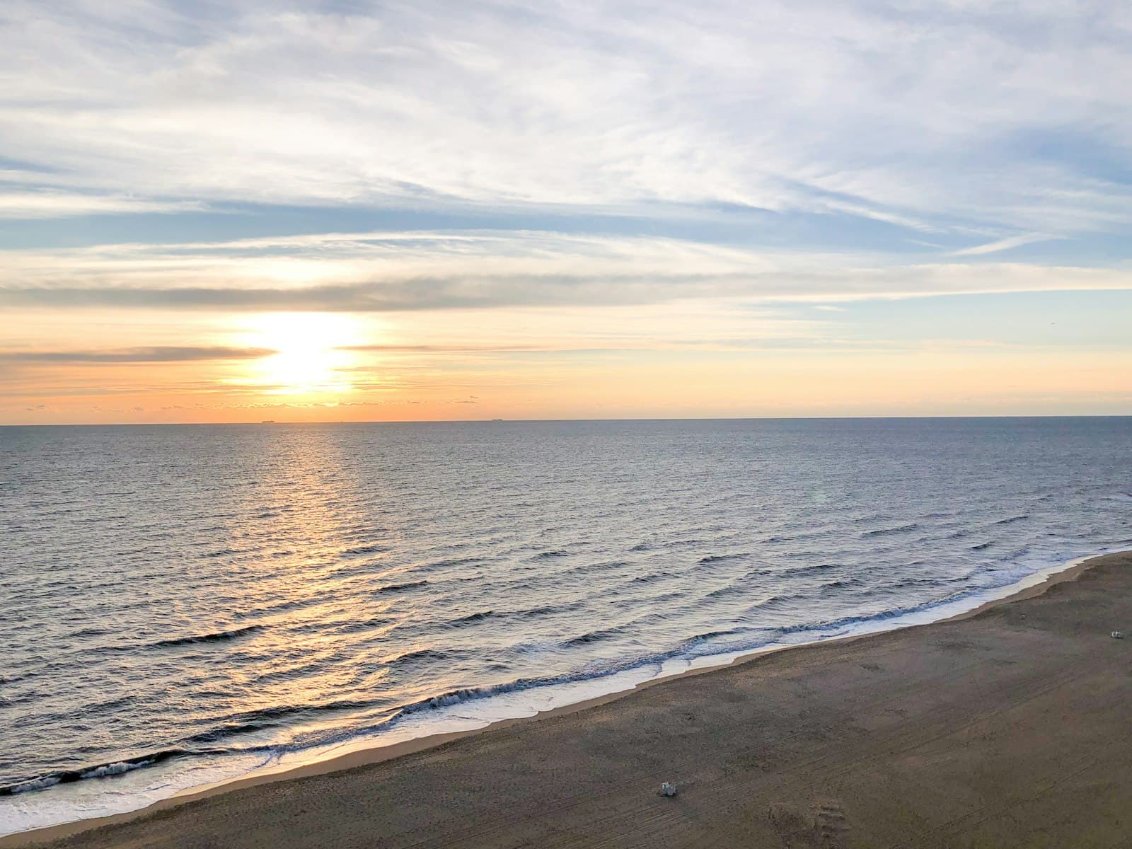 Virginia Beach — sea waves crashing on shore during sunset