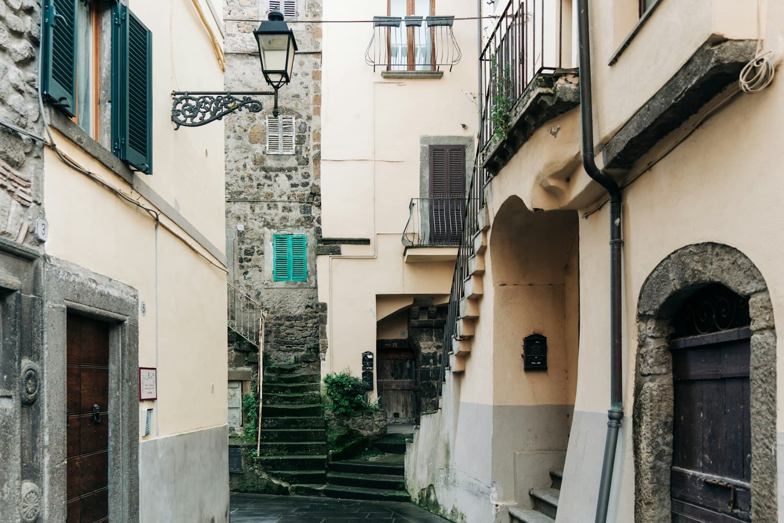 Viterbo — a narrow alleyway with stone buildings and stairs