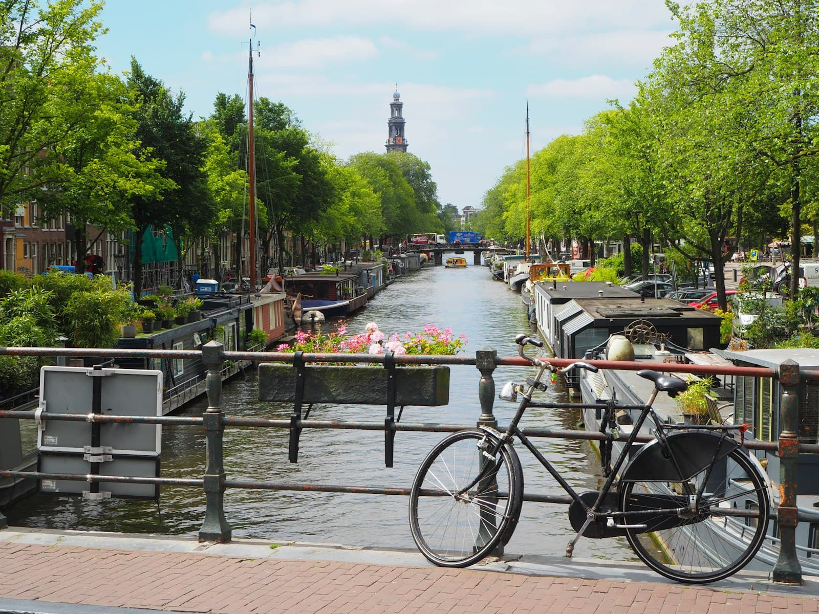 Volendam — black city bike parked beside river during daytime