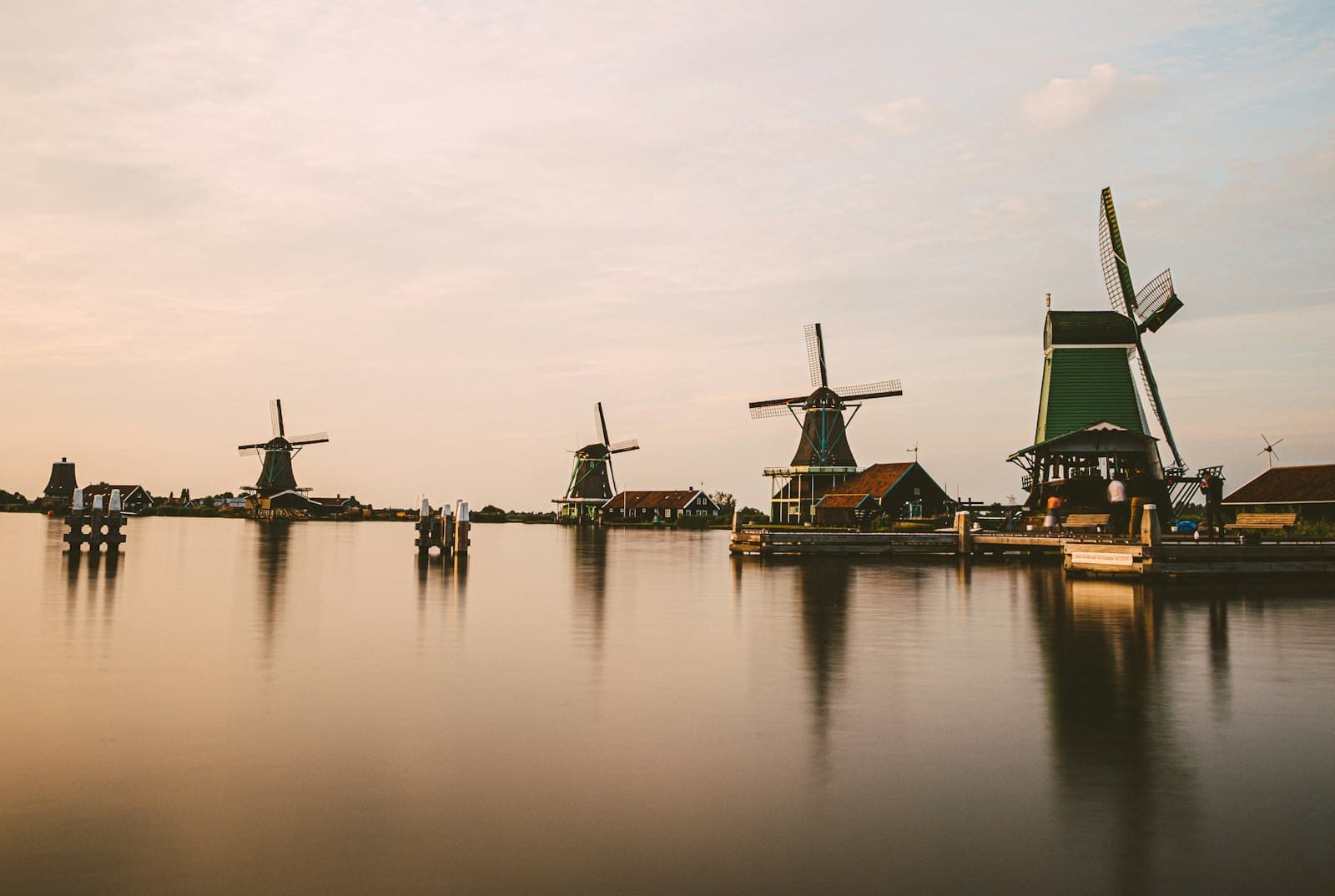 Volendam — a group of windmills sitting on top of a lake