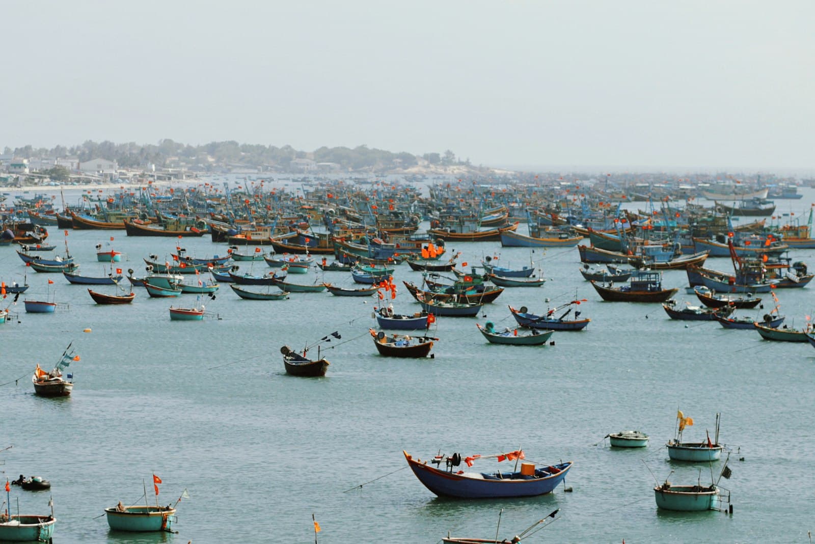 Vũng Tàu — red and white boat on sea during daytime