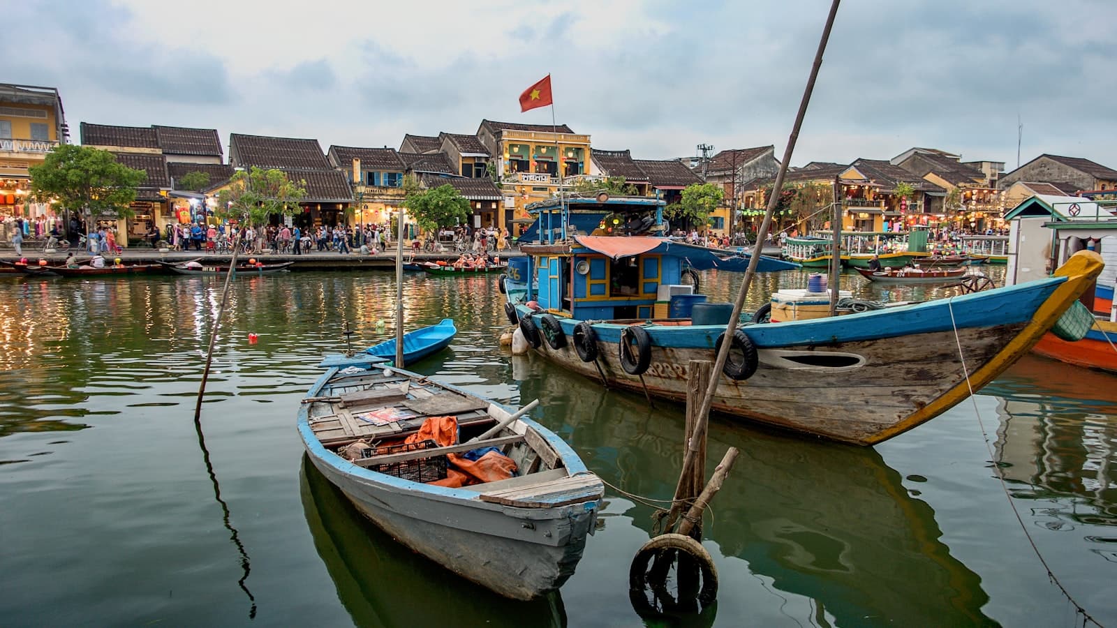 Vũng Tàu — white and brown boat on water near houses during daytime