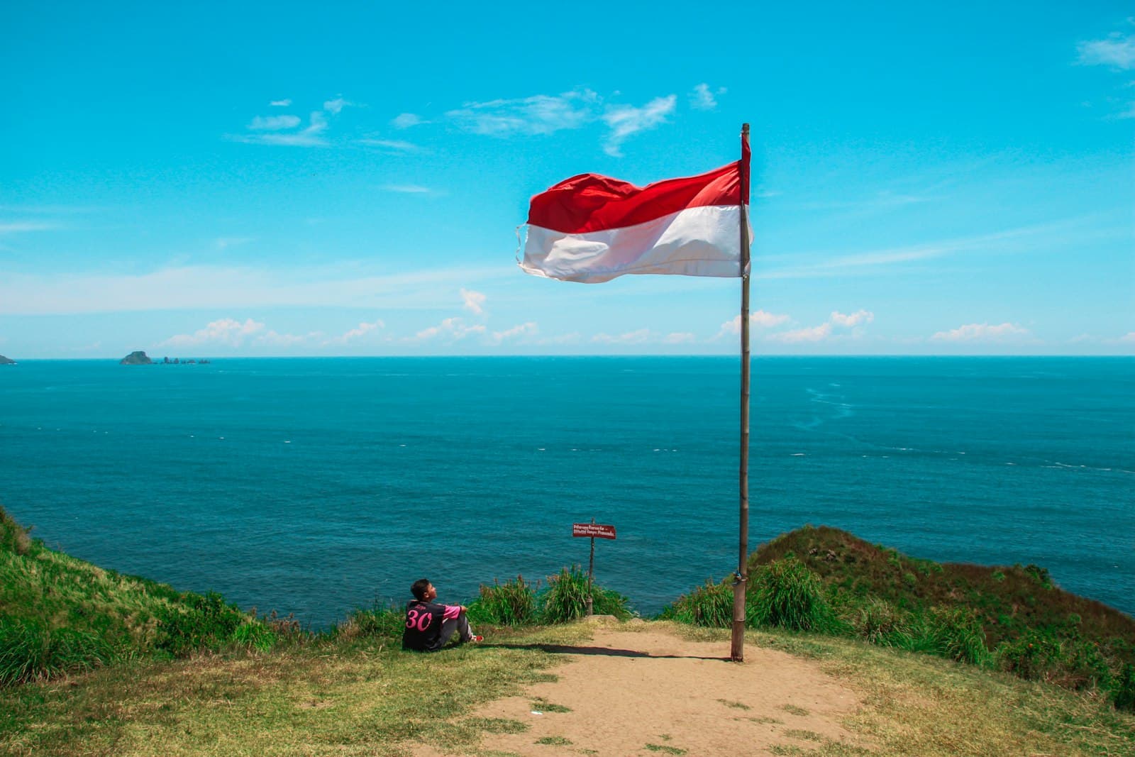 Waikabubak — red and white flag beside beach