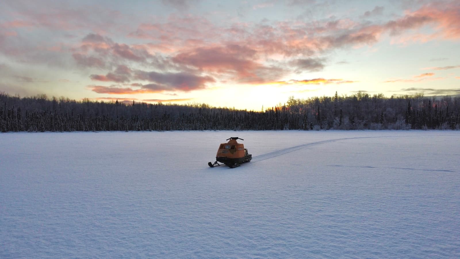 Wasilla — person riding on black kayak on snow covered field during daytime