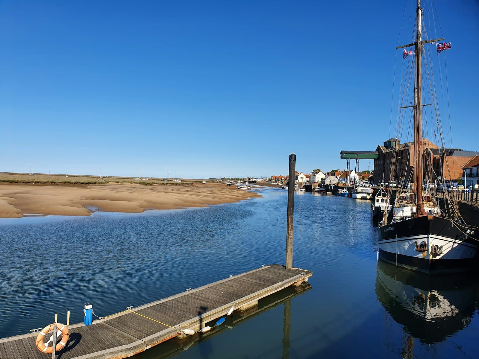 Wells-next-the-Sea — a boat is docked at a pier on the water