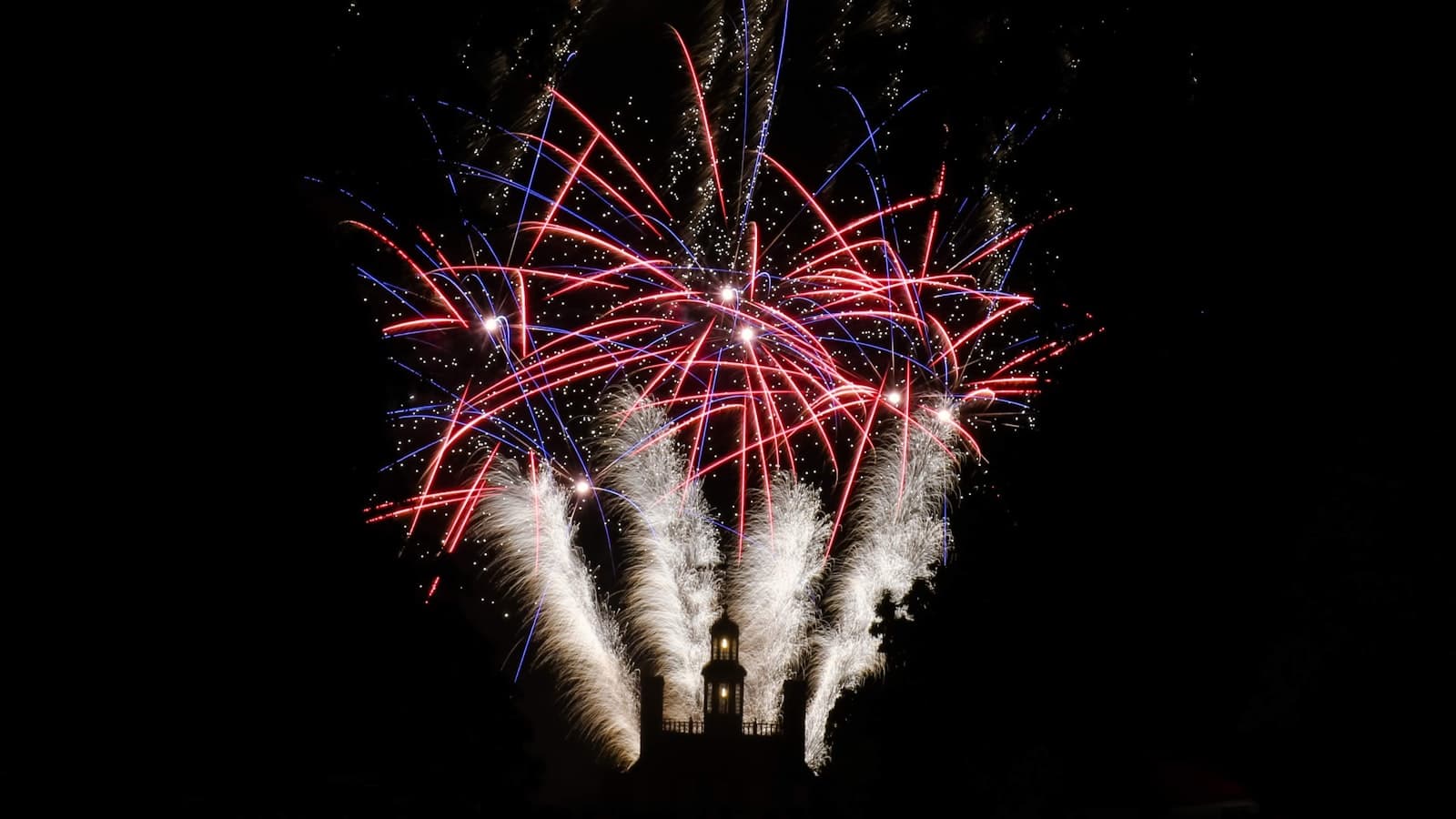Williamsburg — a bunch of fireworks are lit up in the night sky