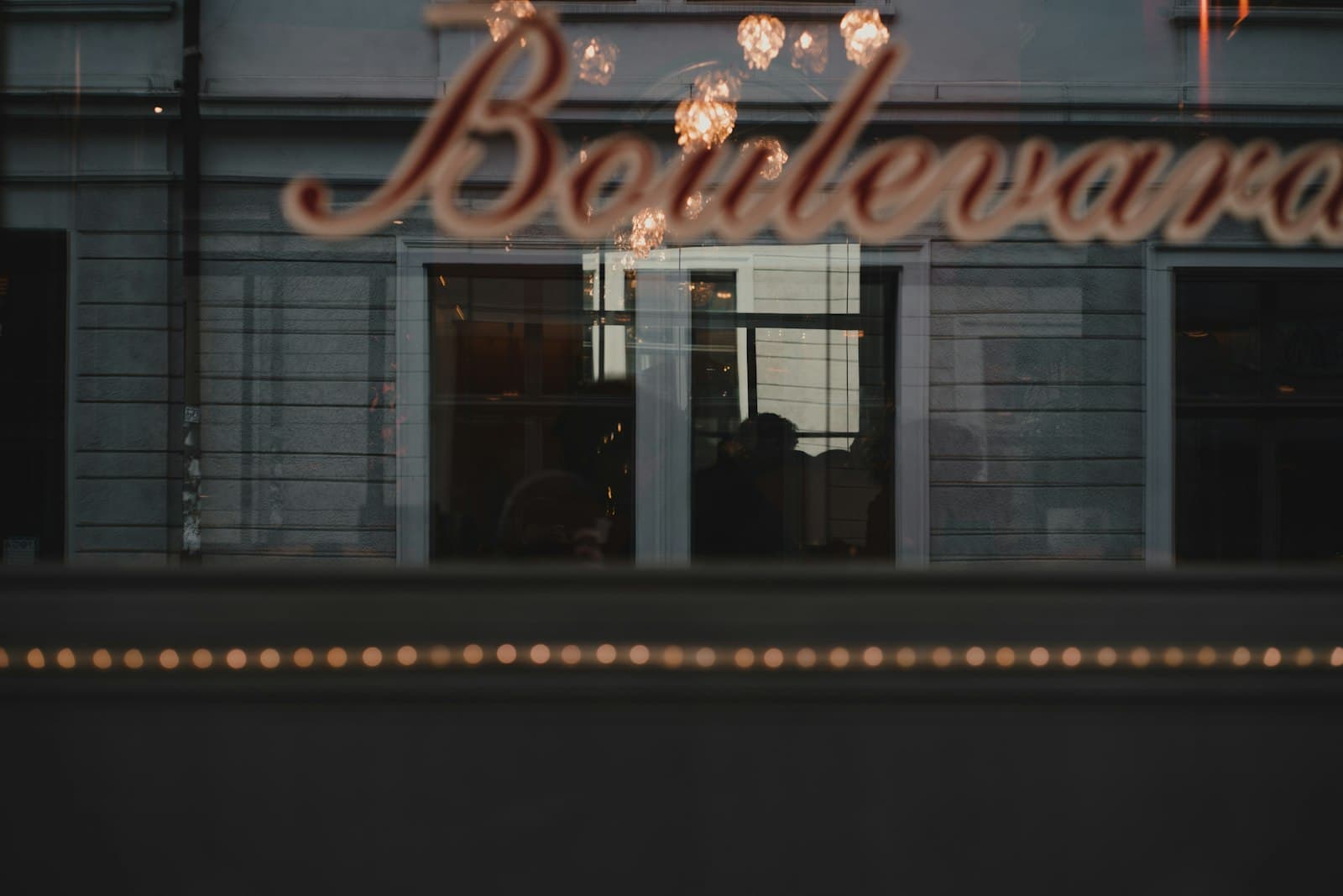 Winterthur — the reflection of a restaurant sign in a window