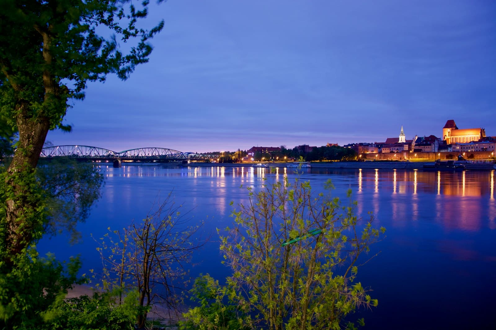 Wisła — city, bridge, and body of water during night