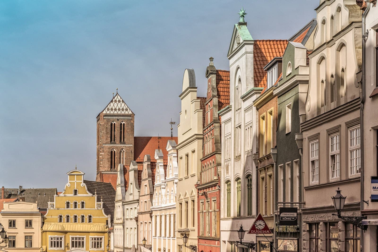 Wismar — a row of buildings with a clock tower in the background