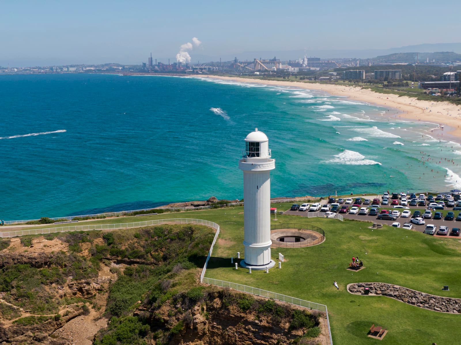 Wollongong — a white lighthouse on a grassy area next to the ocean