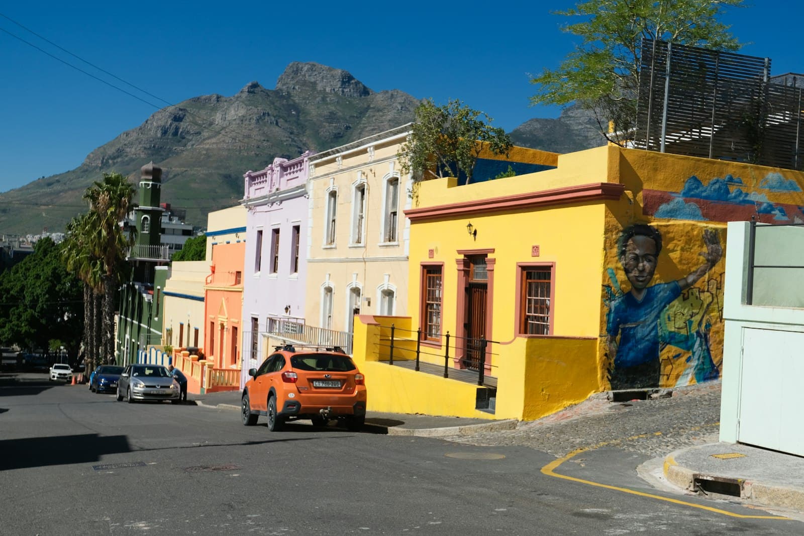 Woodstock Street Art — A street scene with cars parked on the side of the road