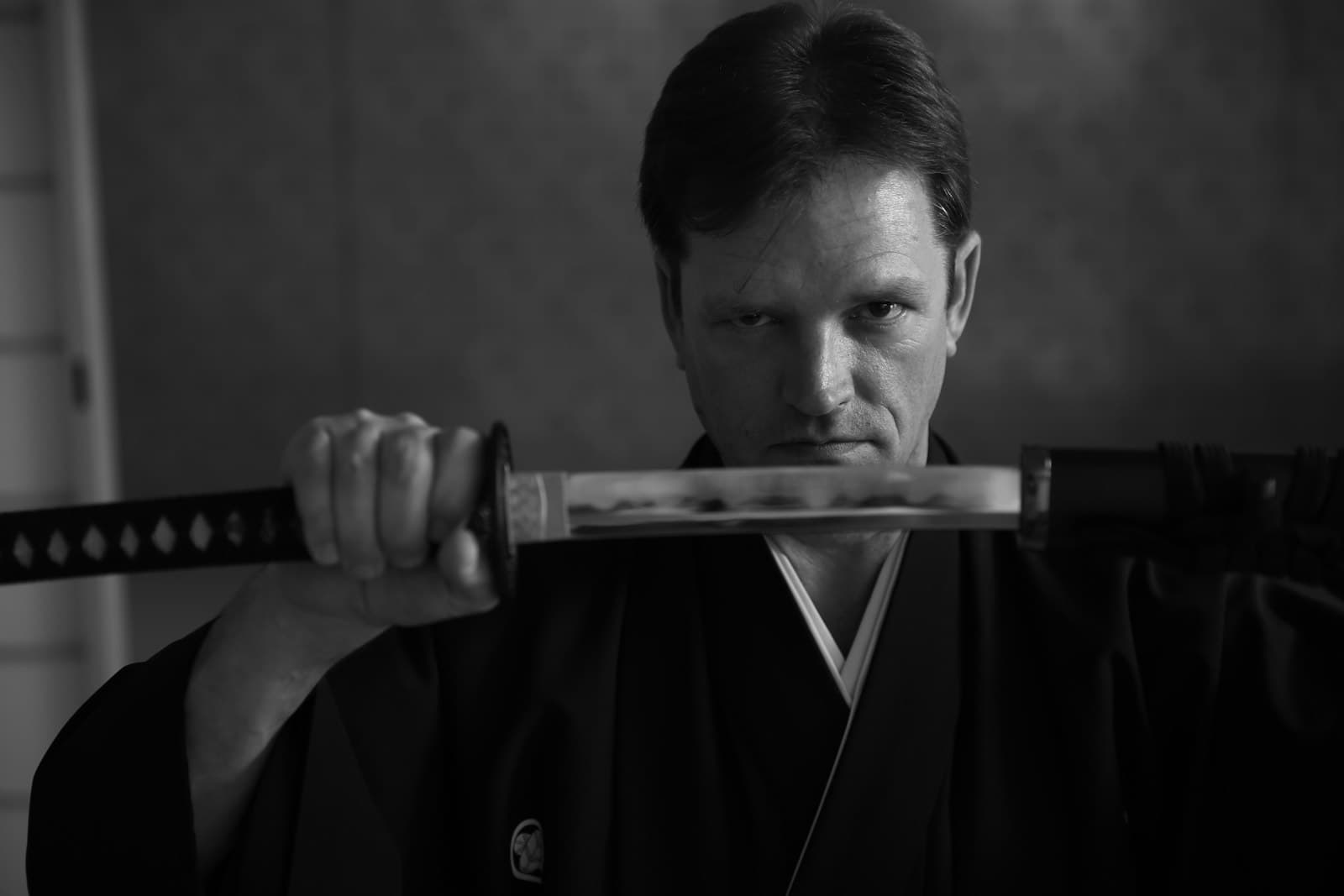 Yokosuka — man in black suit holding sword