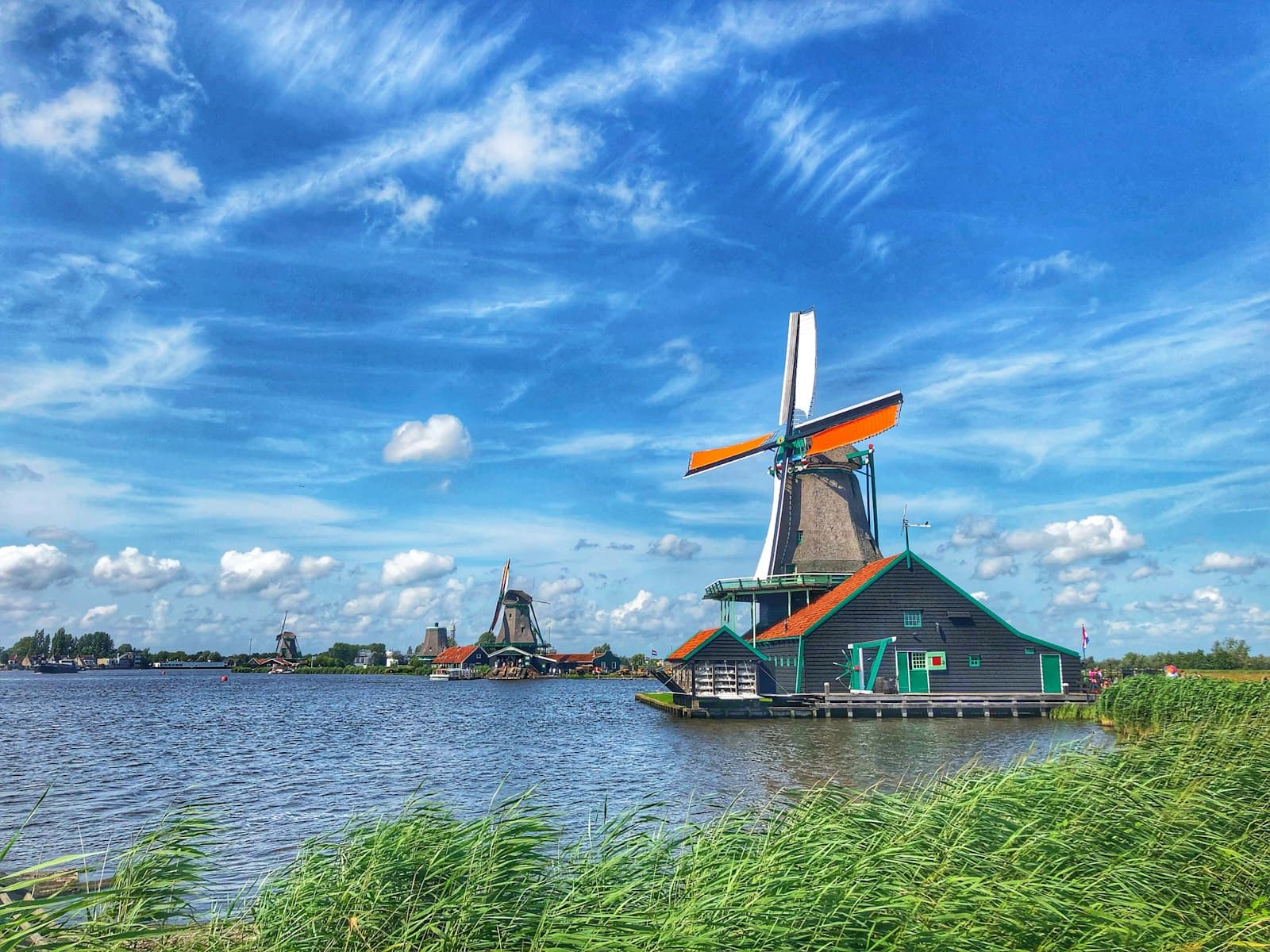 Zaandam — a windmill sitting on top of a body of water