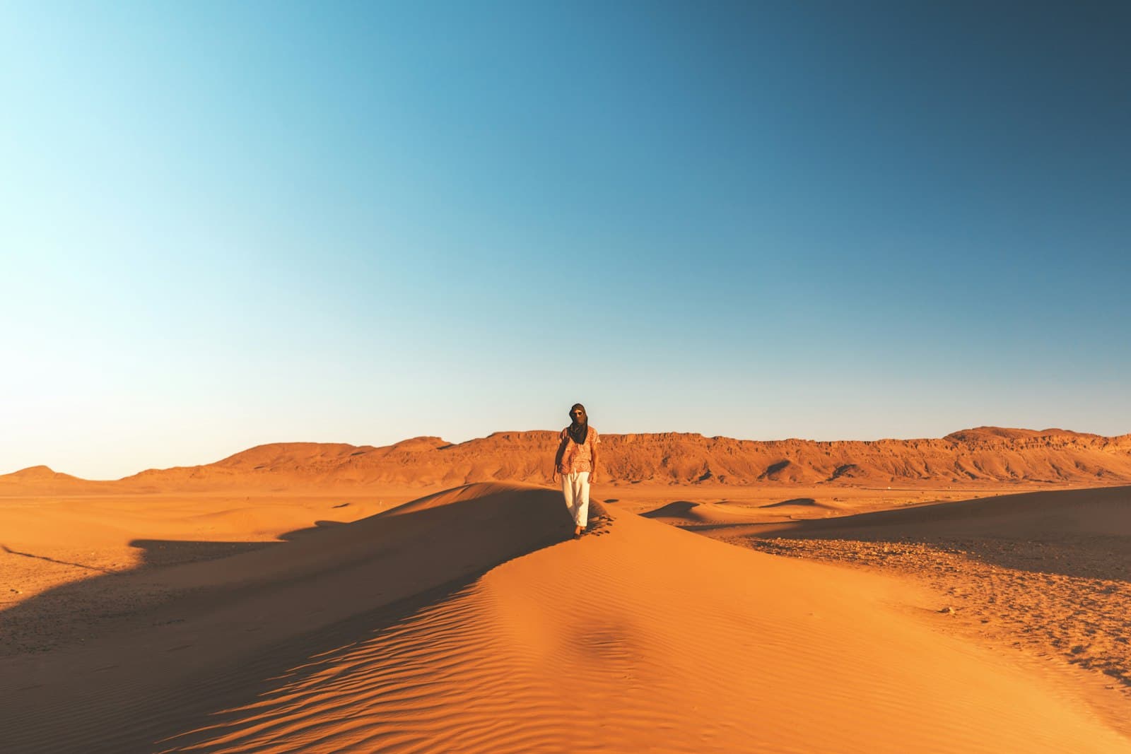 Zagora — man walking on desert