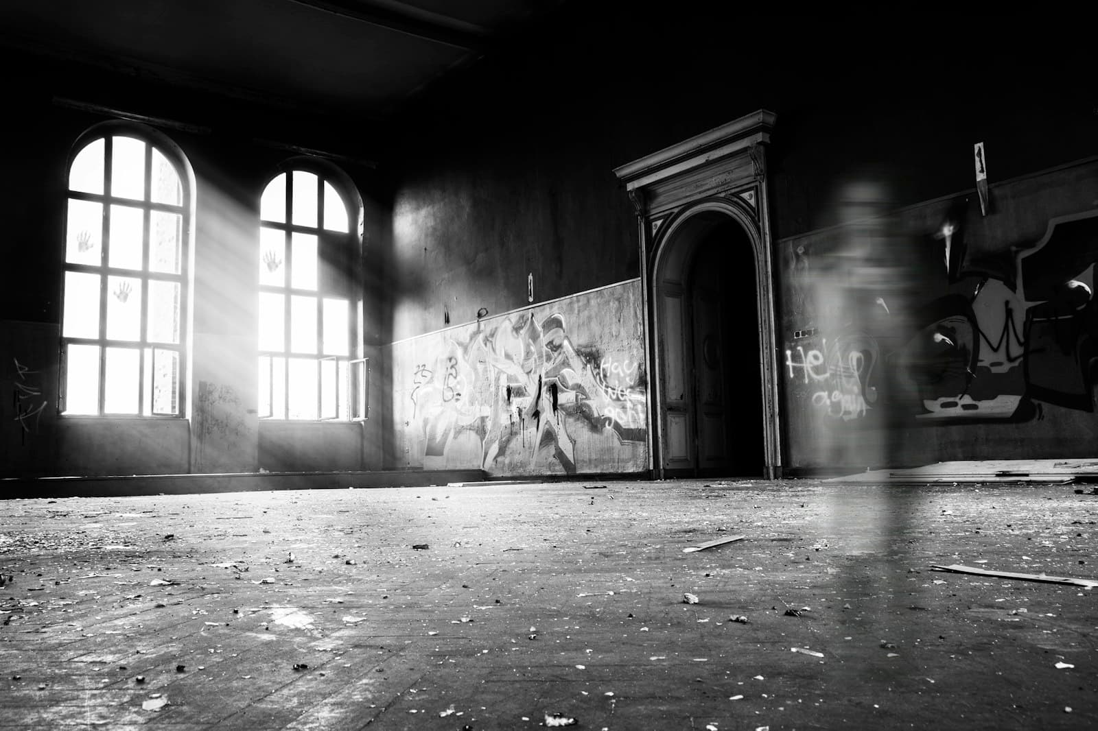 Zeitz — grayscale photo of person standing inside building