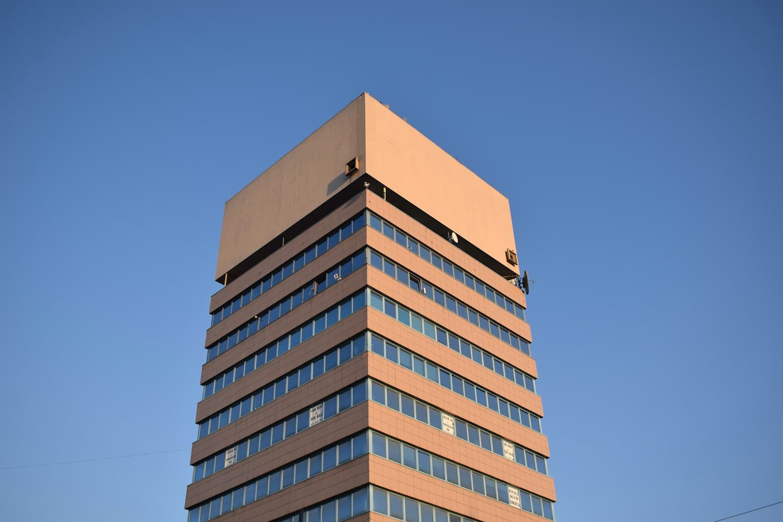 Zrenjanin — brown and white concrete building under blue sky during daytime