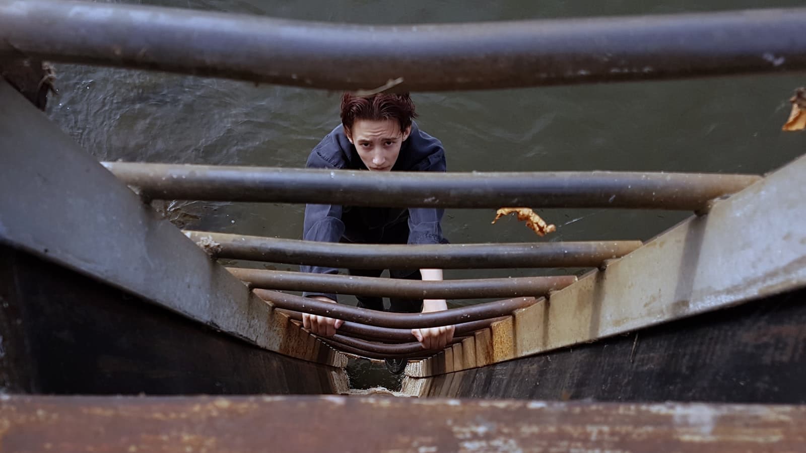 Zutphen — boy climbing on ladder above water